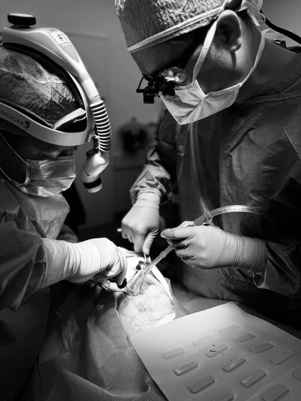 Dr. Nader Salib operating with a surgical colleague in a hospital operating room